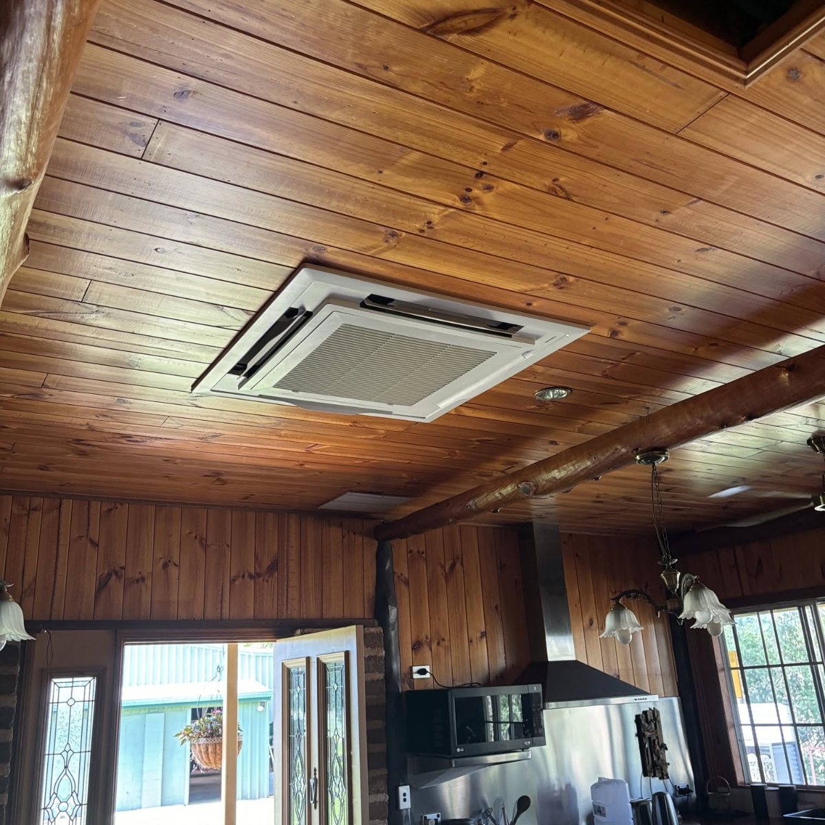 Ceiling cassette air conditioner installed in a timber-lined Far North Queensland home