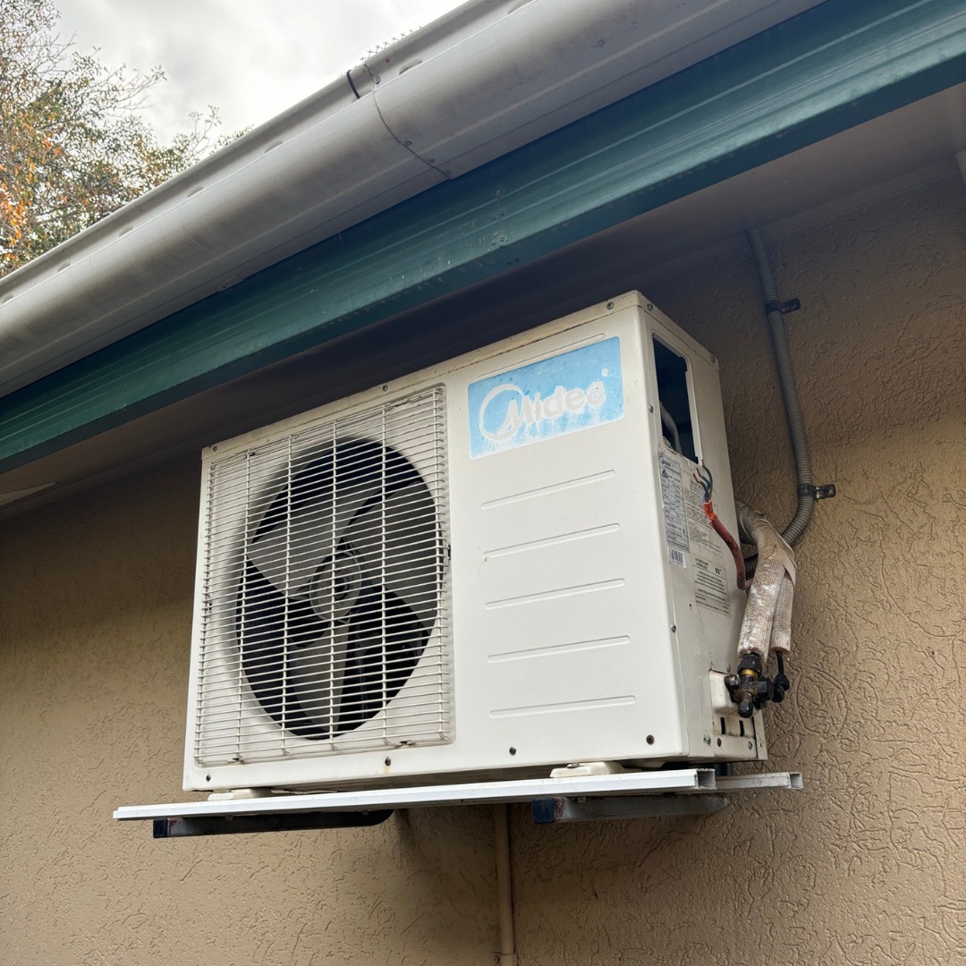 Old air conditioning outdoor unit before replacement at a Cairns property