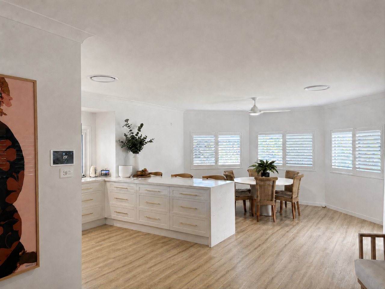 Open-plan living area kept comfortable by ducted air conditioning vents