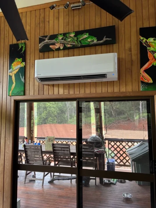 Split system air conditioner installed on a timber wall in a Cairns home