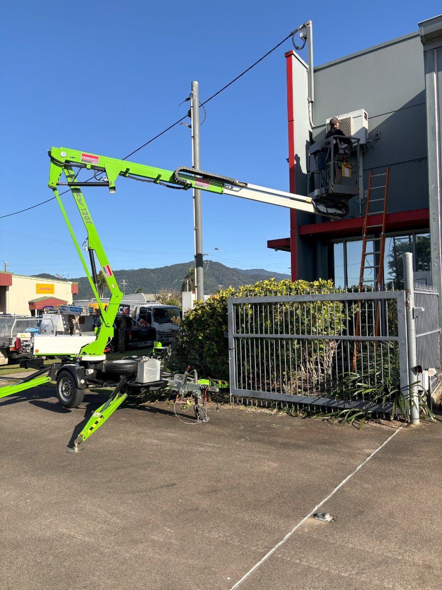 Crane lift replacing air conditioning plant at a managed Cairns shopfront