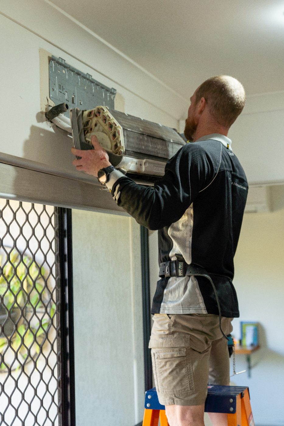 Airtek technician replacing a split system indoor unit in a Cairns home