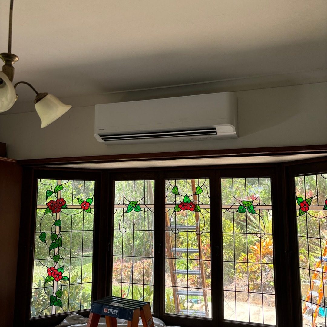Toshiba split system installed above leadlight windows in a Cairns home